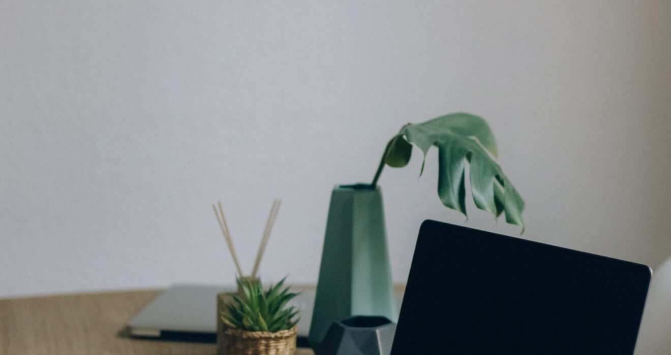 Free Black Laptop Computer On Brown Wooden Table Stock Photo